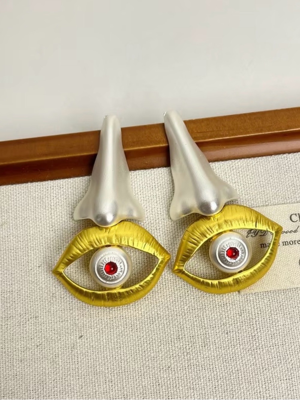 Schiaparelli Inspired Statement Gold Eye Drop Earrings with Silver Accents